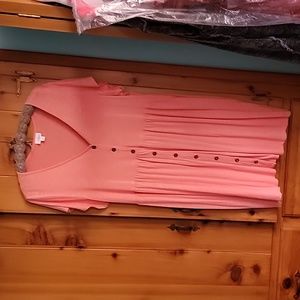 Light orange/peach color LuLaRoe dress with pockets.